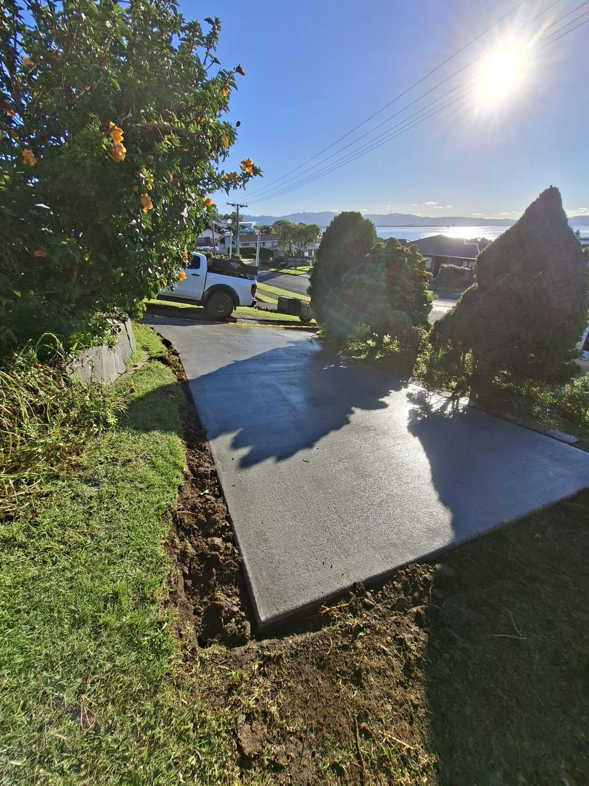 Residential concrete driveway extension with harbour views in Tauranga